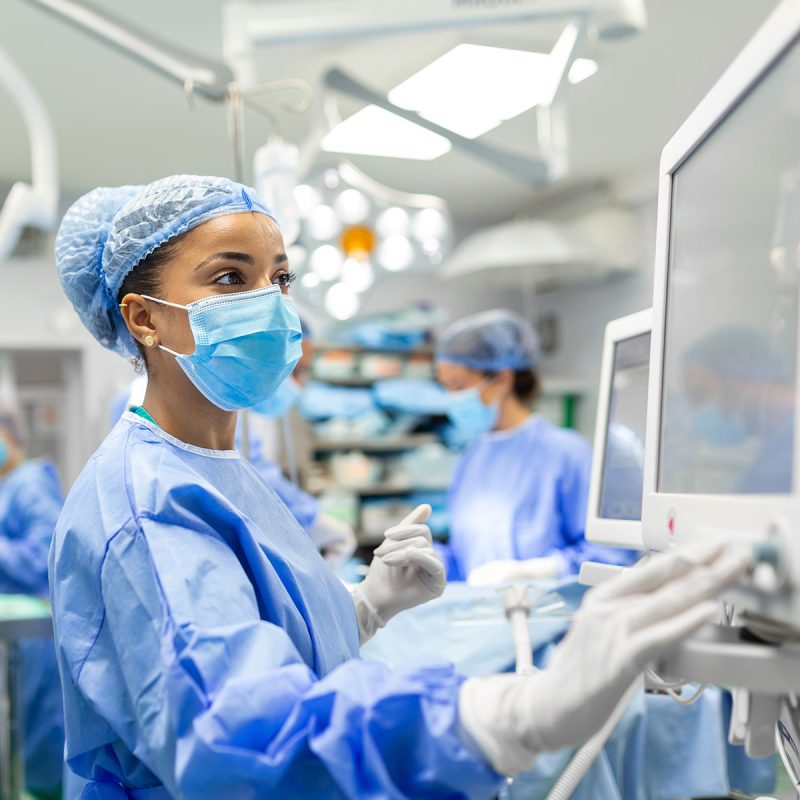 A surgeon checking a monitor